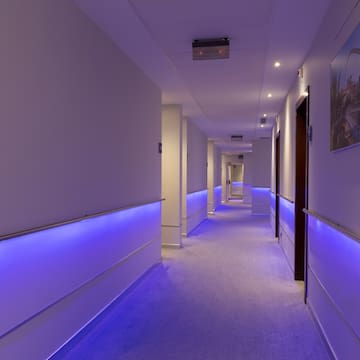 a hallway with purple lights