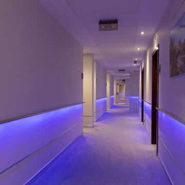 a hallway with purple lights