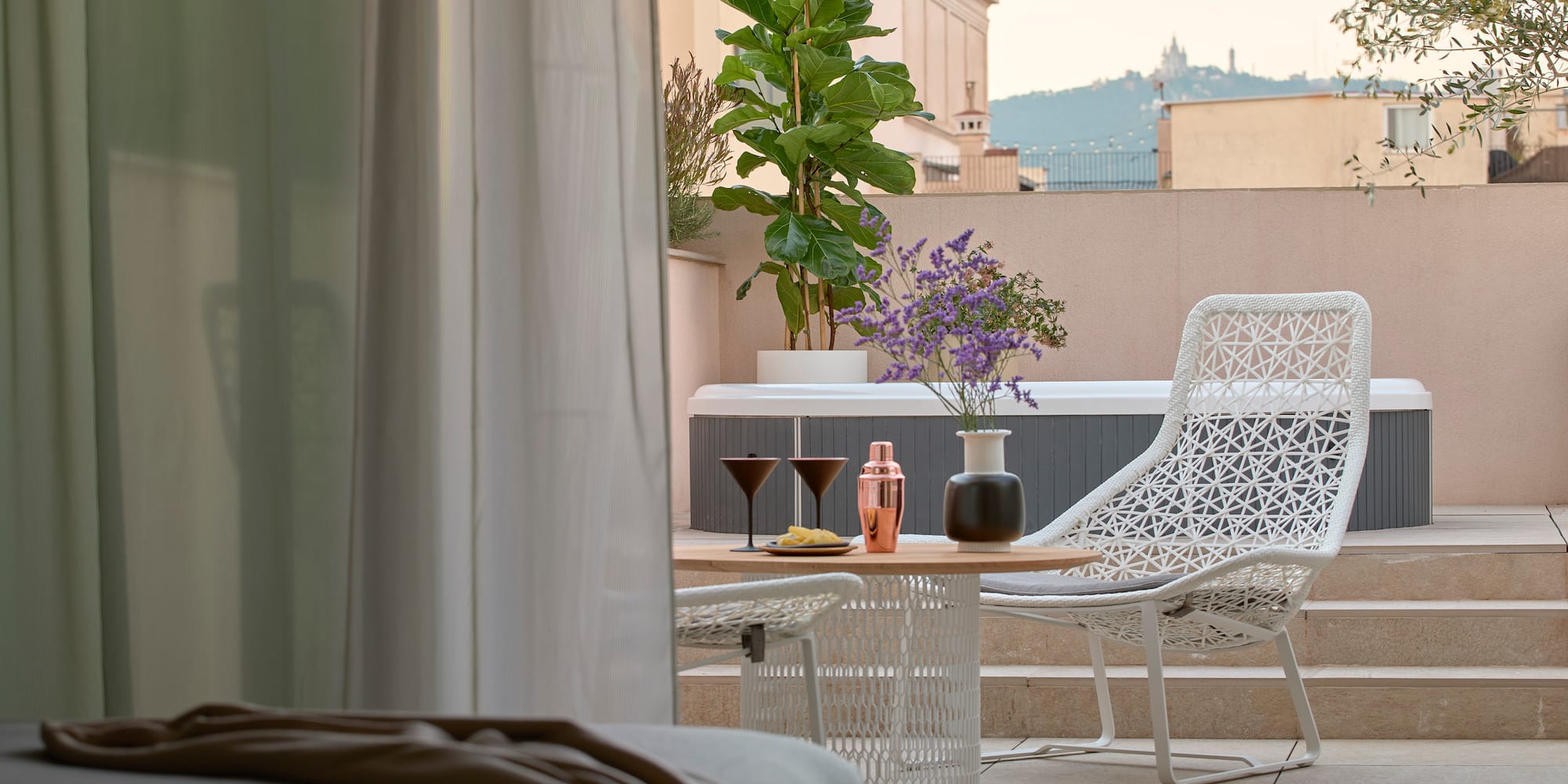 a patio with a table and chairs
