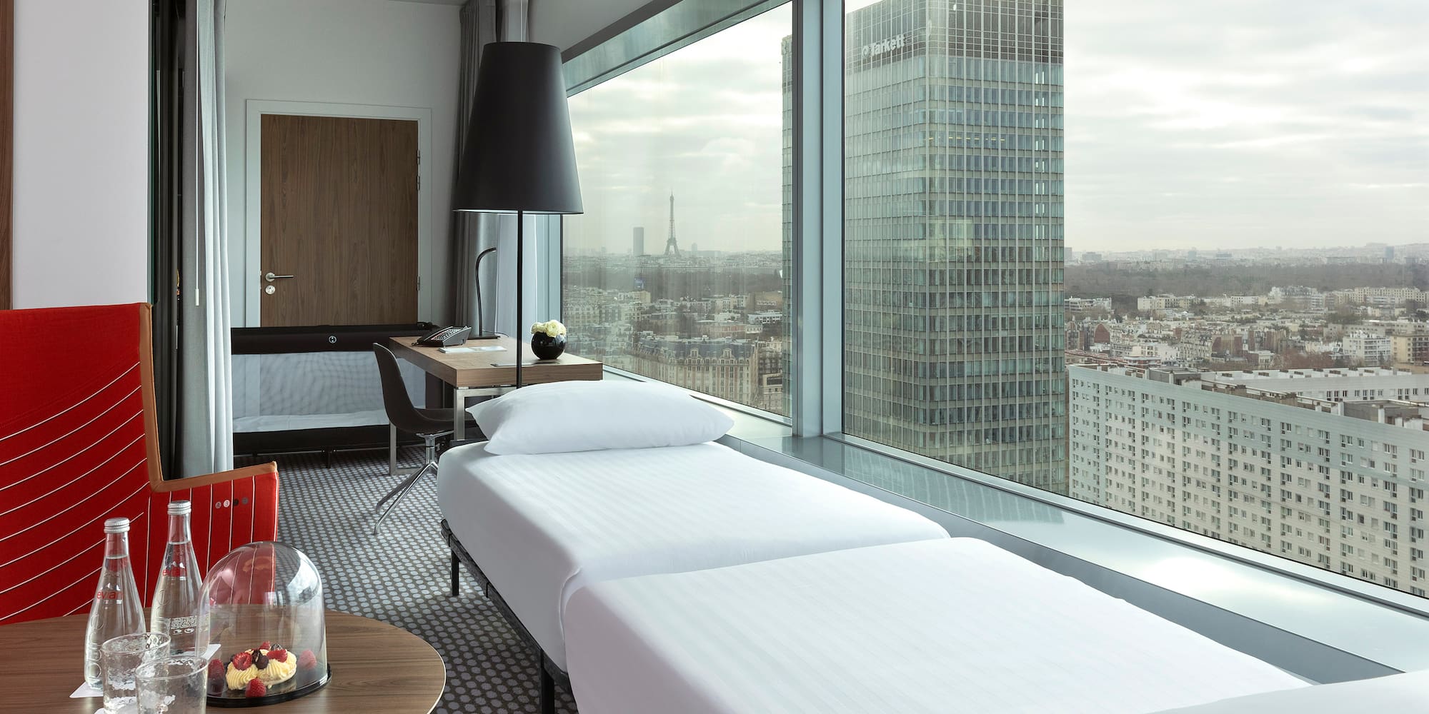 a room with a window overlooking a city