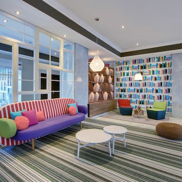 a room with colorful couches and chairs