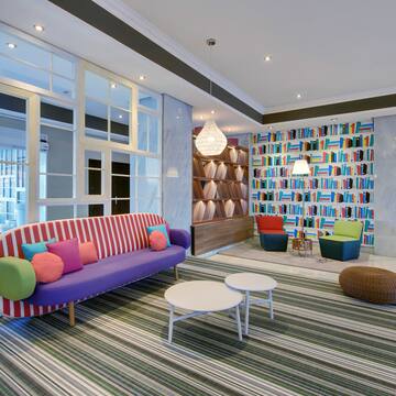 a room with colorful couches and chairs