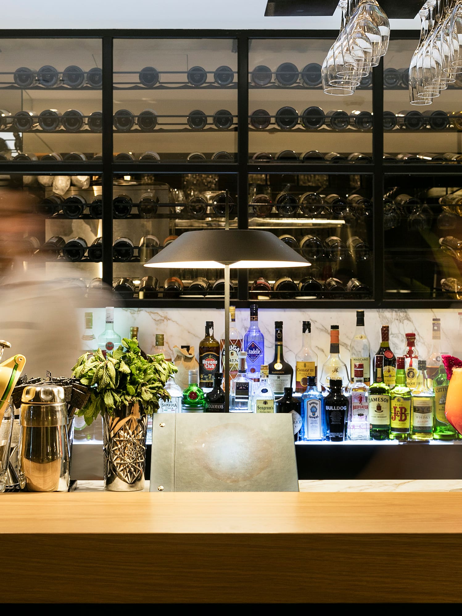 a blurry image of two people behind a bar