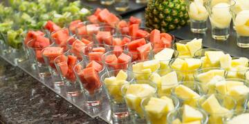 a group of glasses filled with fruit