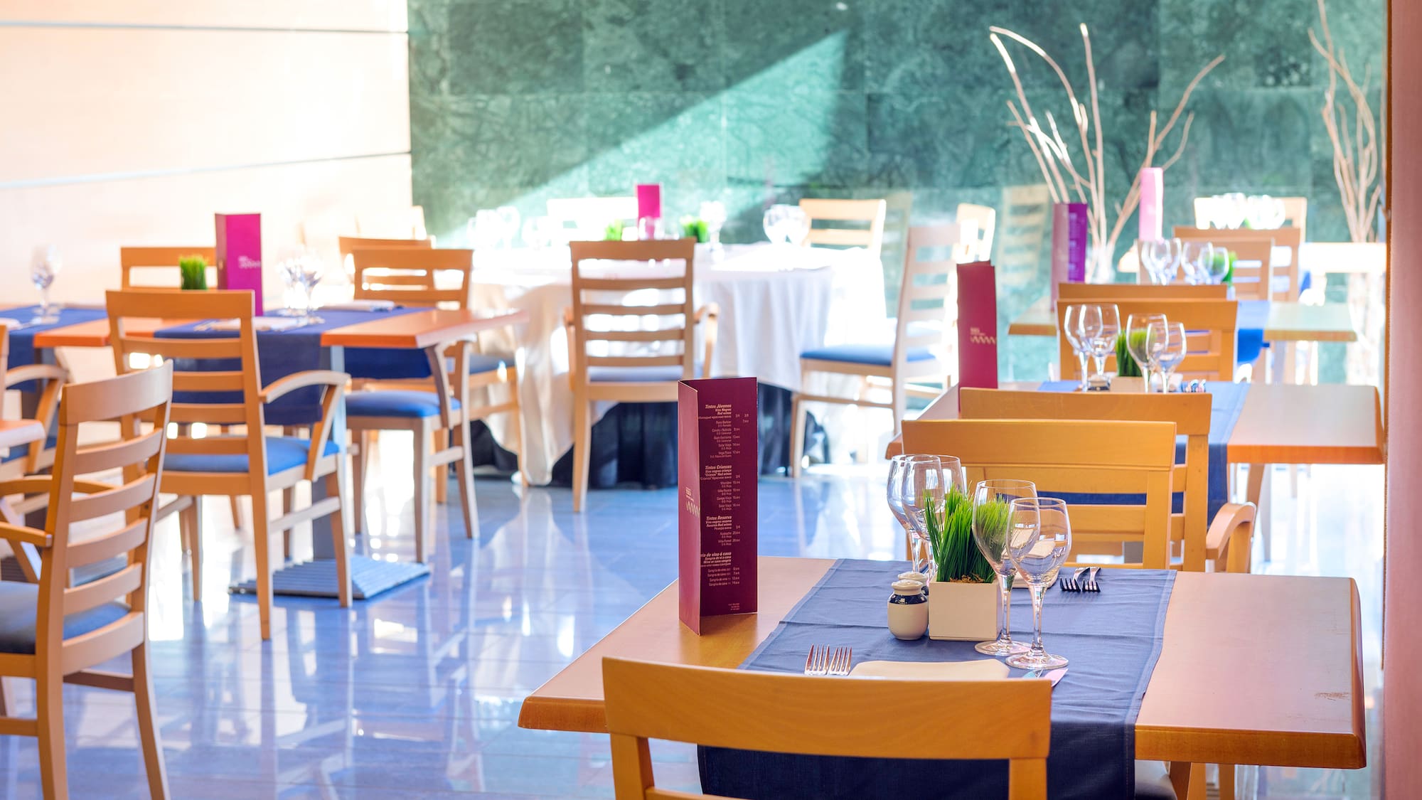 a restaurant with tables and chairs