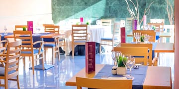 a restaurant with tables and chairs