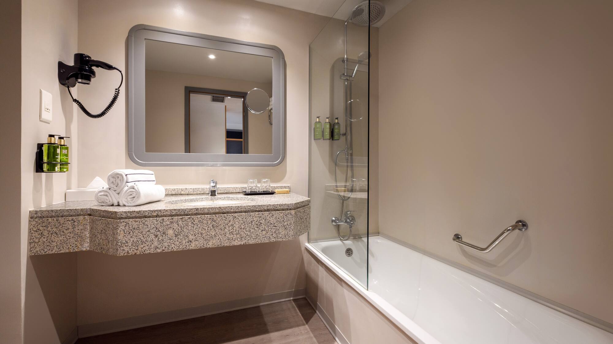 a bathroom with a bathtub and a mirror