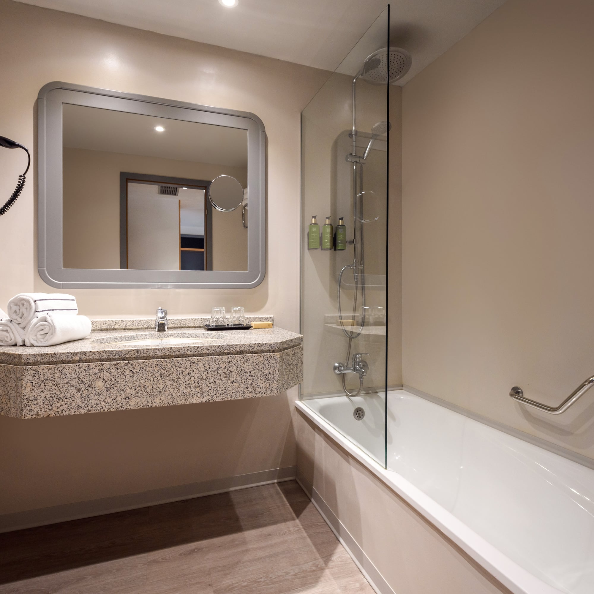 a bathroom with a bathtub and a mirror