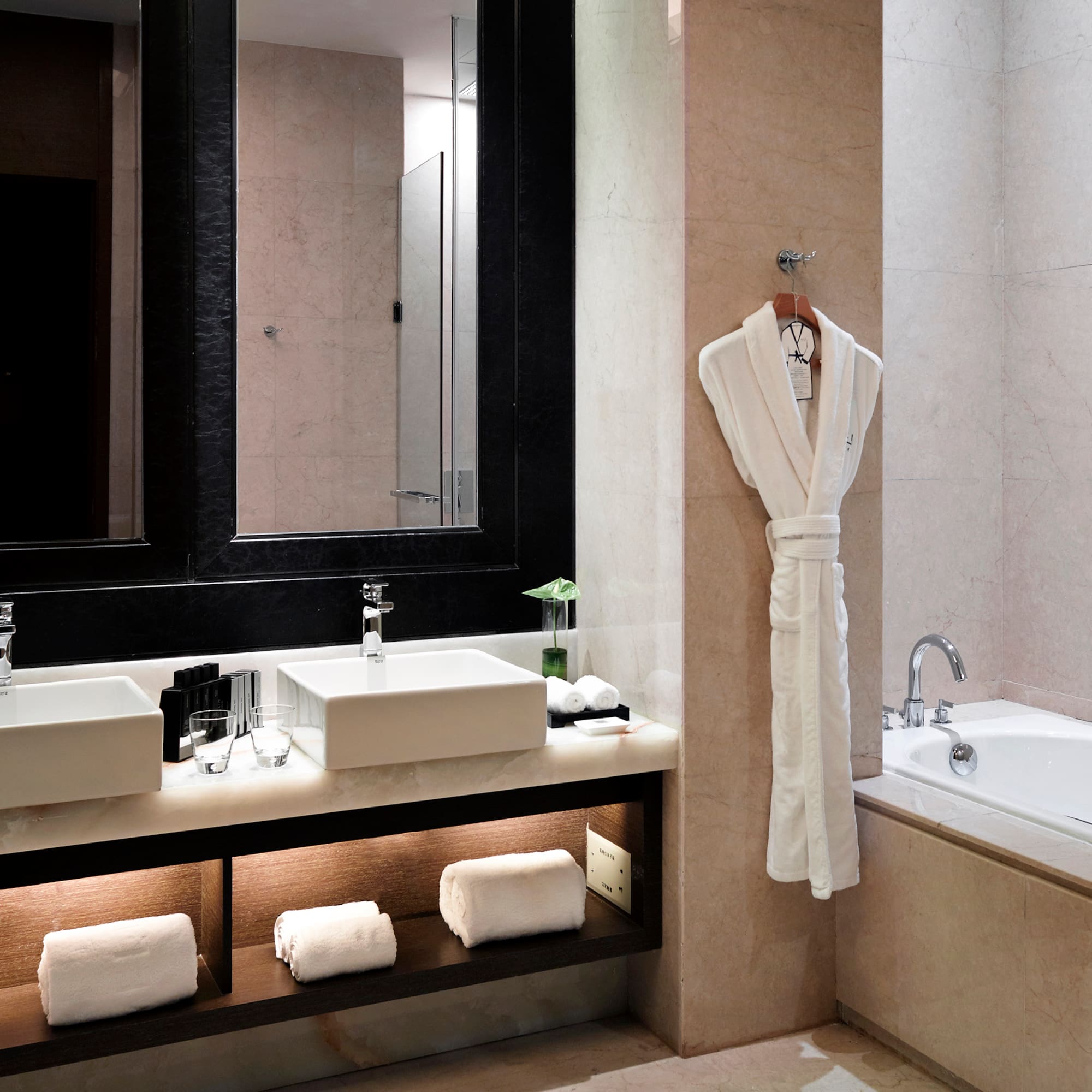 a bathroom with a bathtub and a bathtub