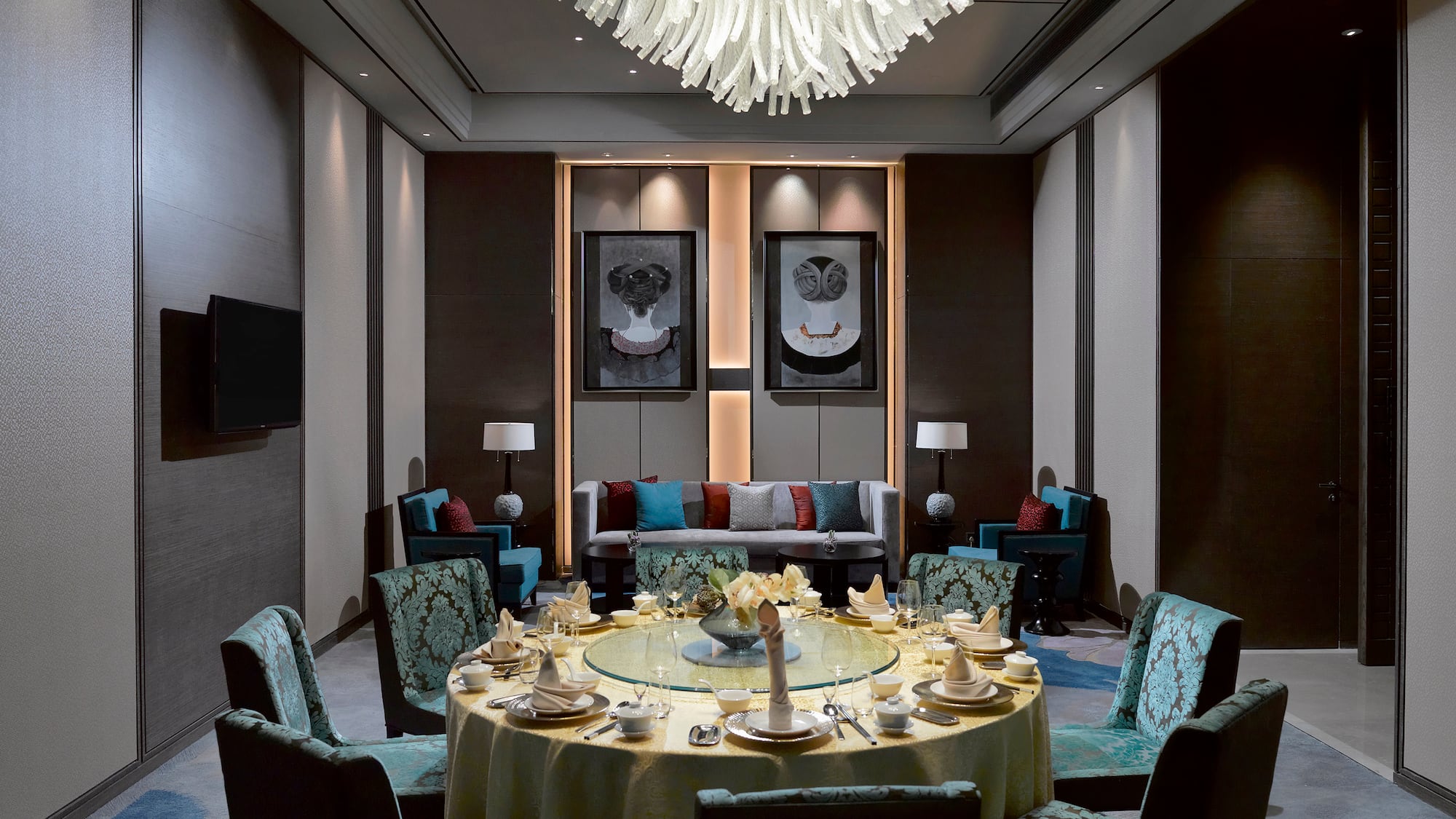 a room with a round table and chairs