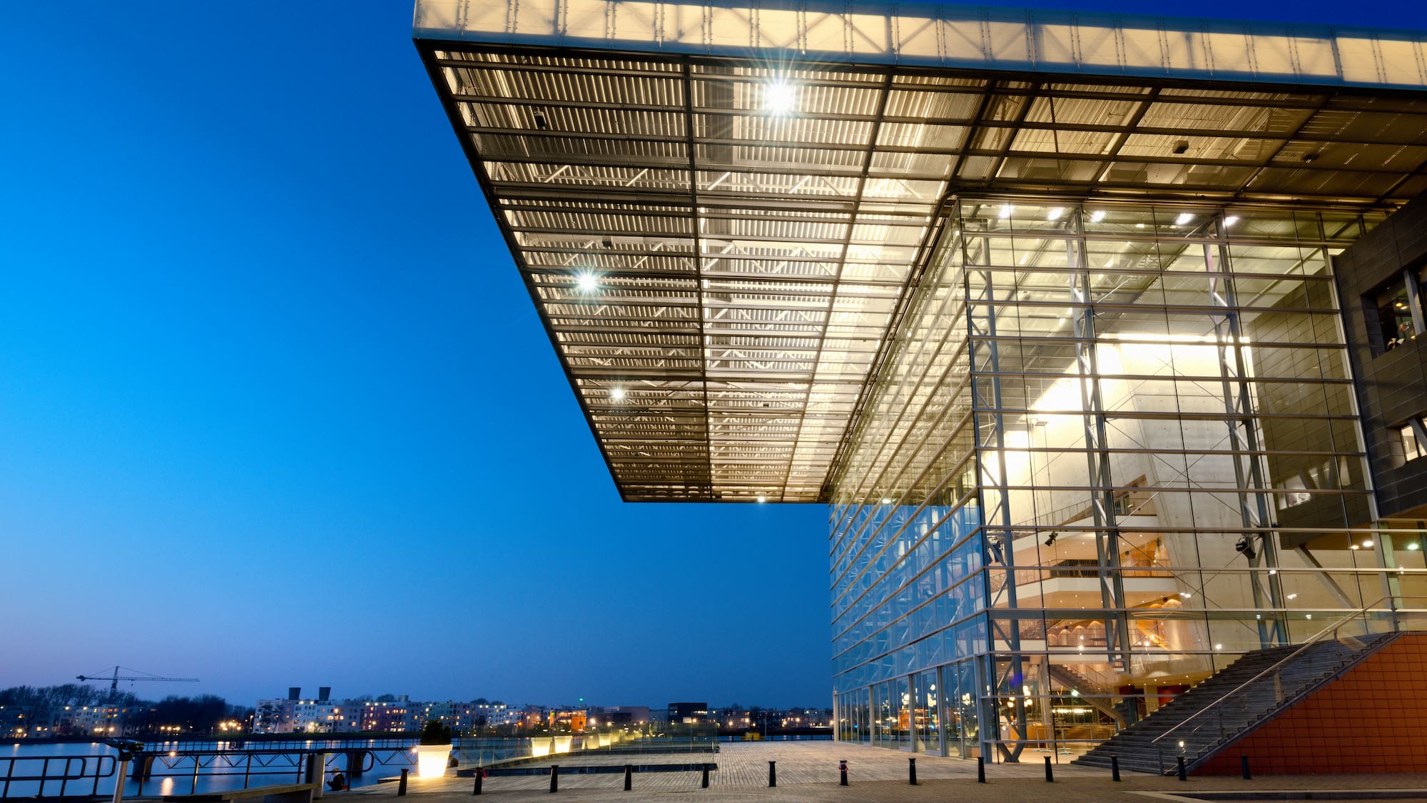 a building with glass walls and a walkway
