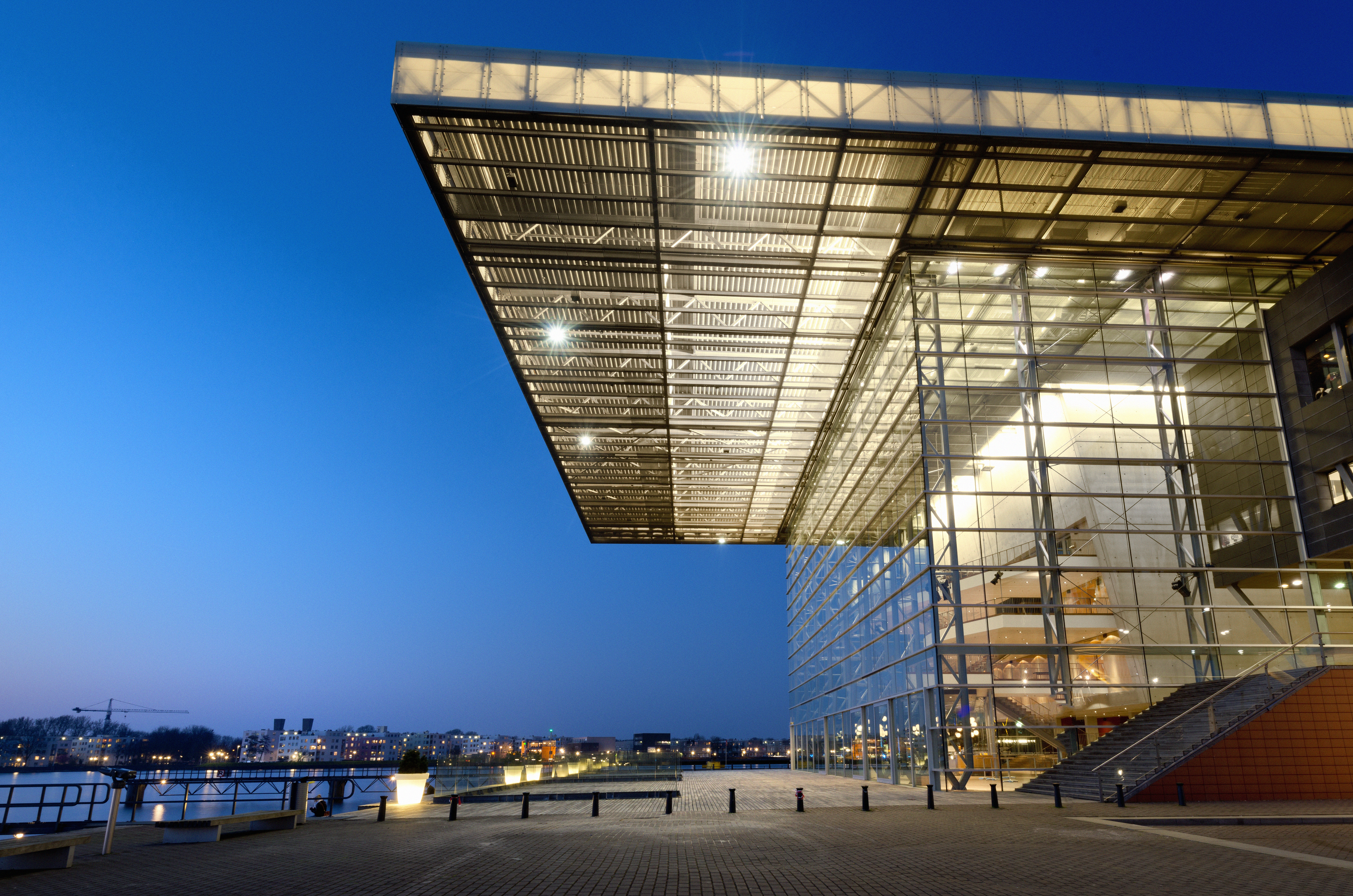 a building with glass walls and a walkway