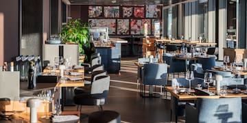 a restaurant with tables and chairs