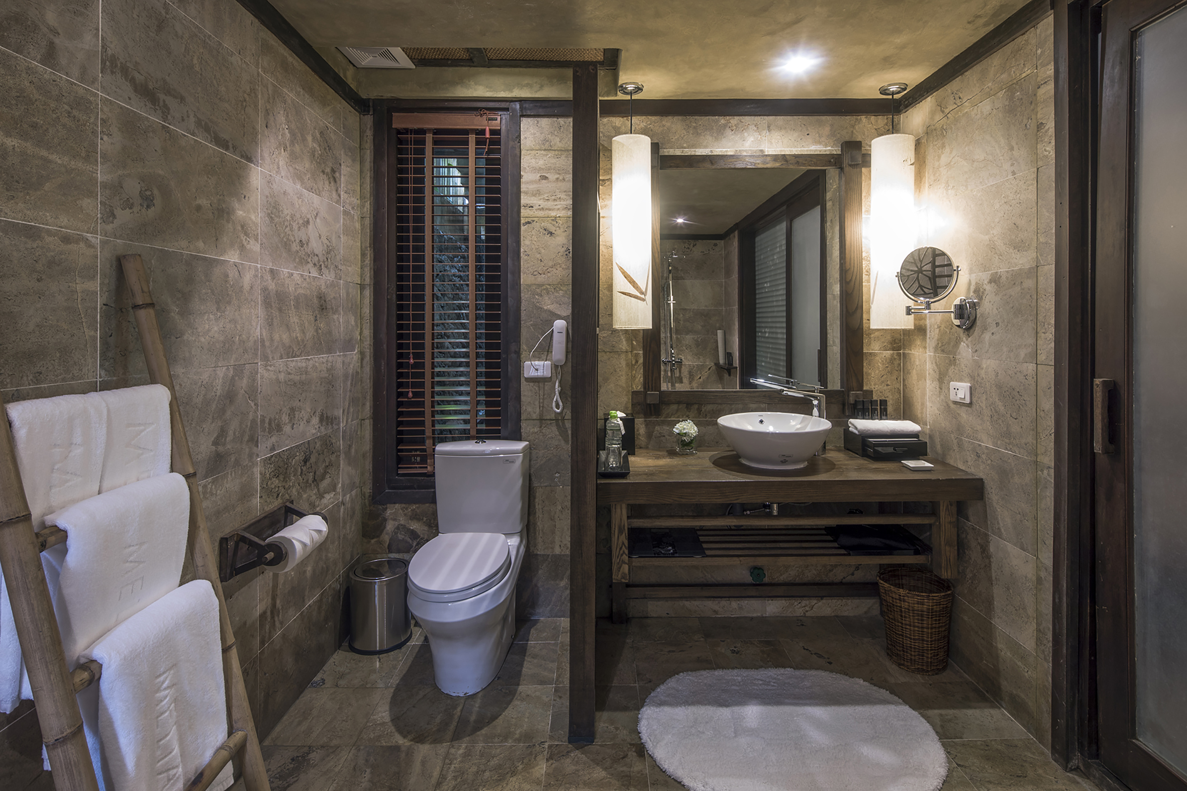 a bathroom with a sink and mirror - Premium - Meliá Ba Vi Mountain Retreat, Hanói