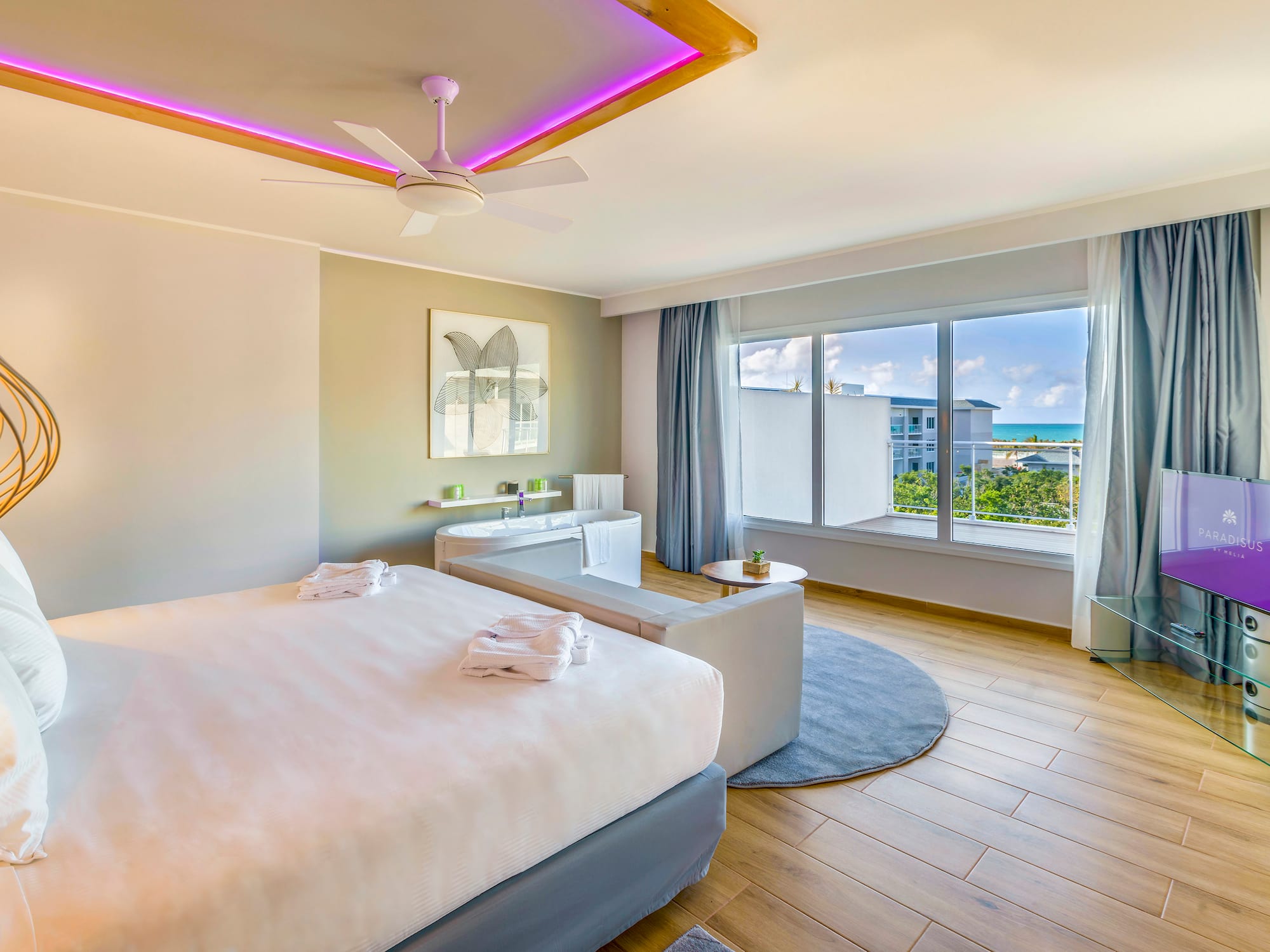 a room with a couch and chairs