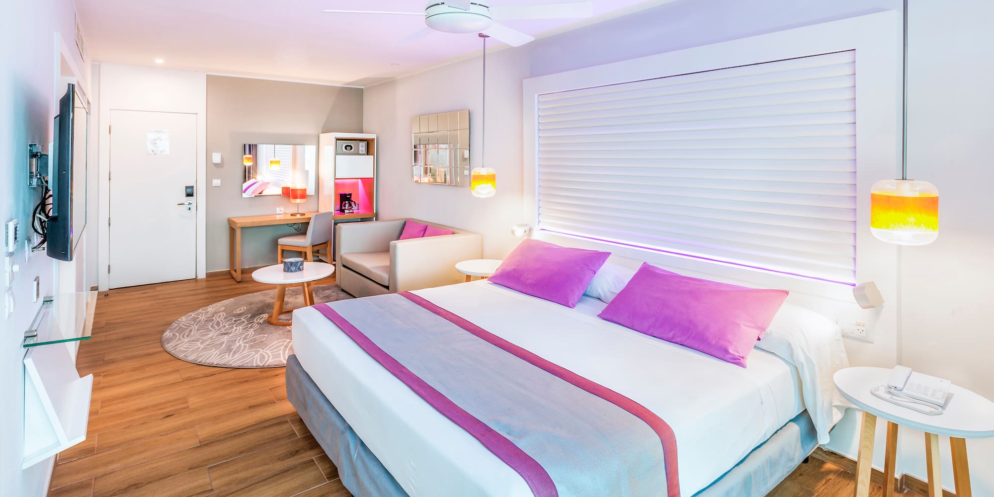 a bedroom with a bed and a ceiling fan