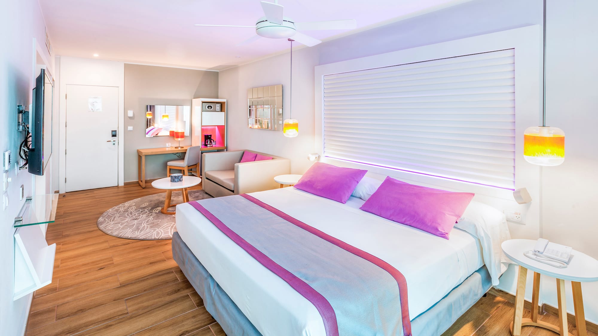 a bedroom with a bed and a ceiling fan