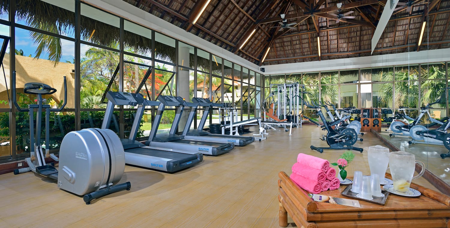 a large room with treadmills and exercise equipment