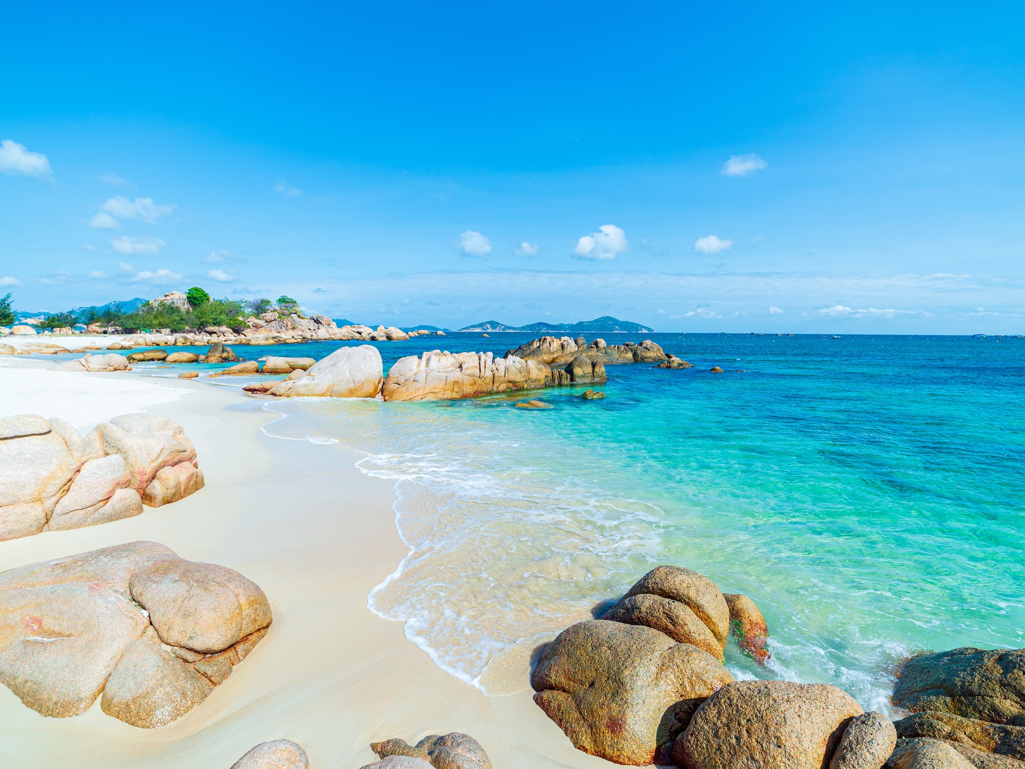a beach with rocks and water