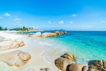 a beach with rocks and water