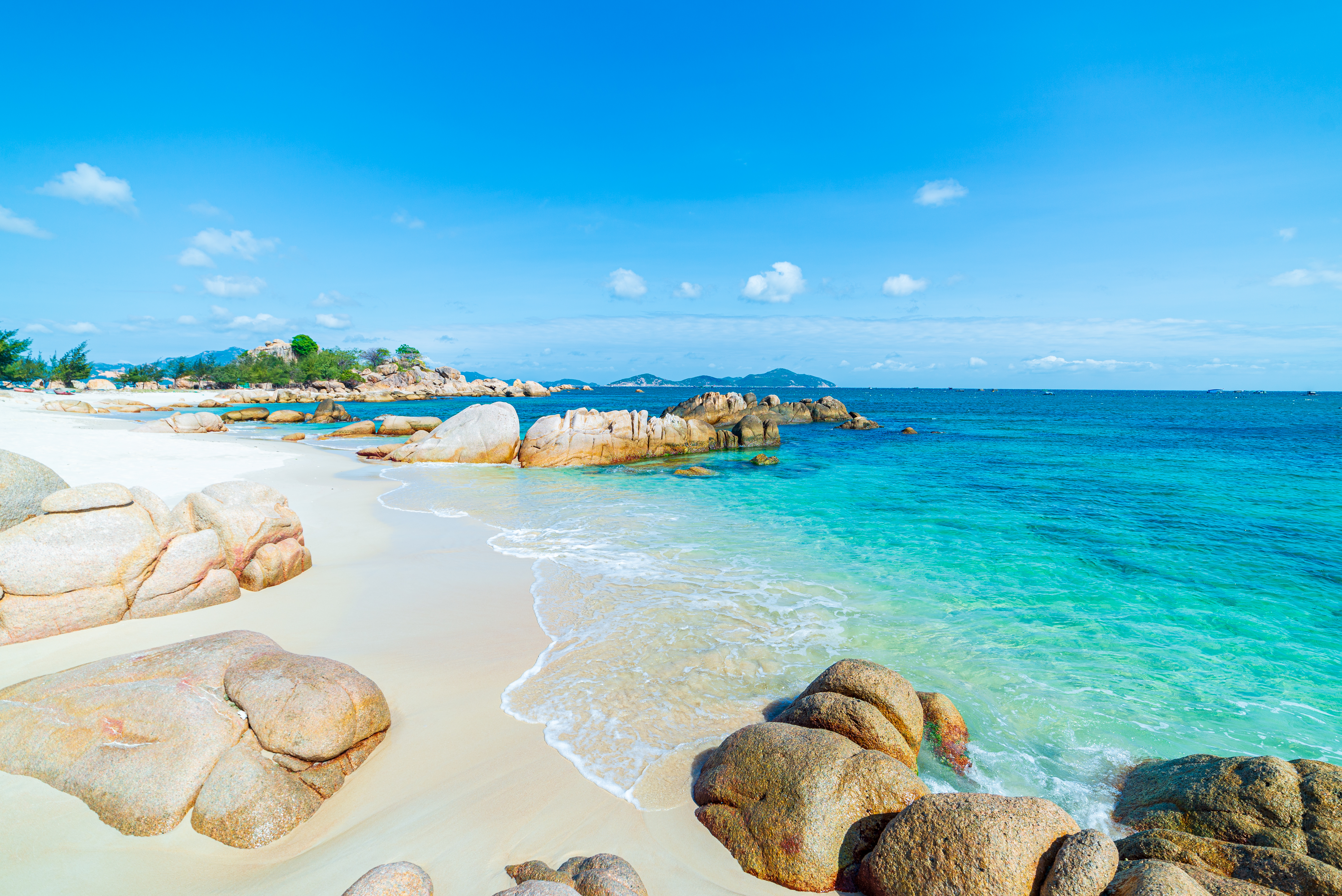 a beach with rocks and water