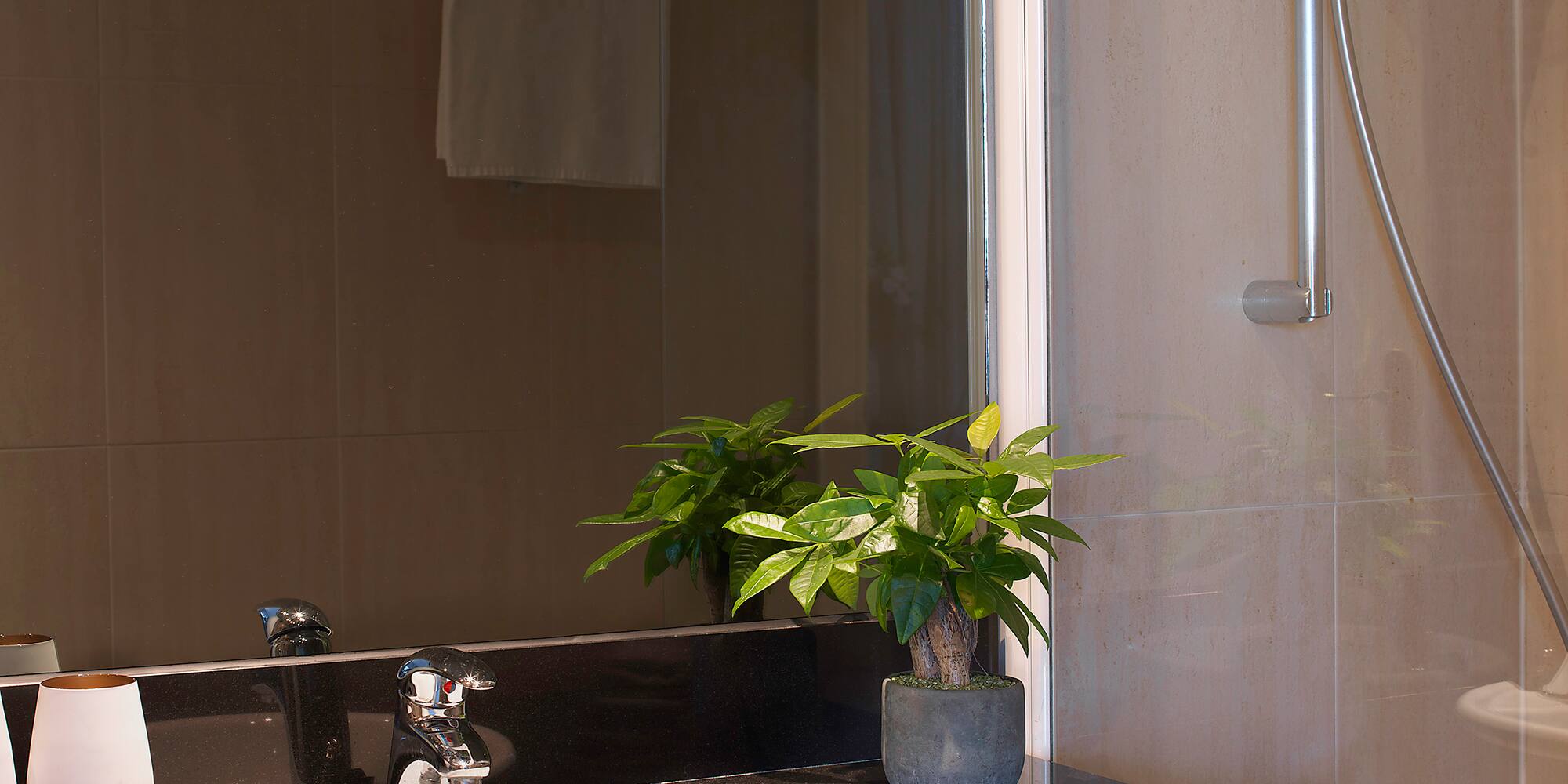 a sink and shower in a bathroom