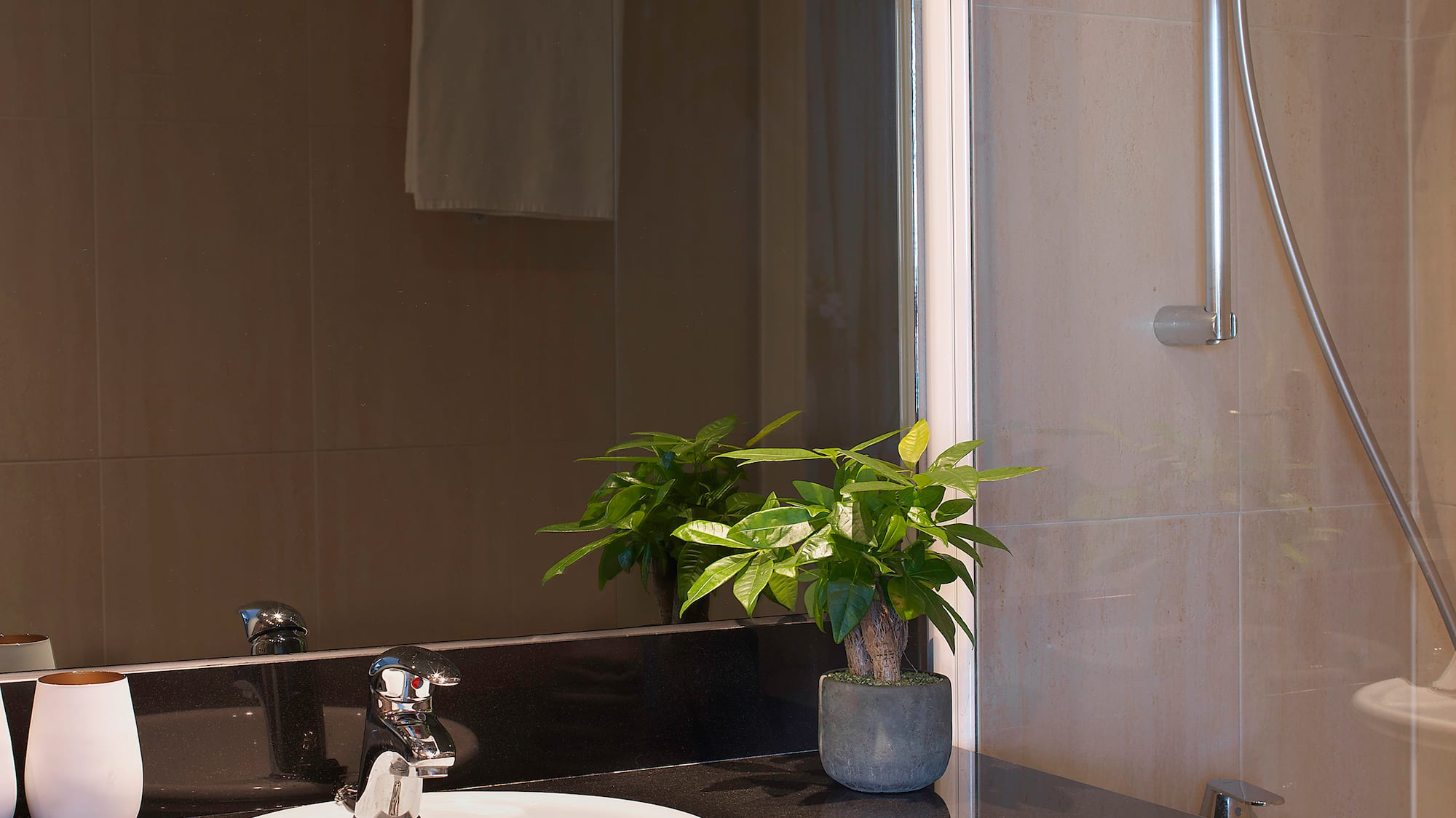 a sink and shower in a bathroom