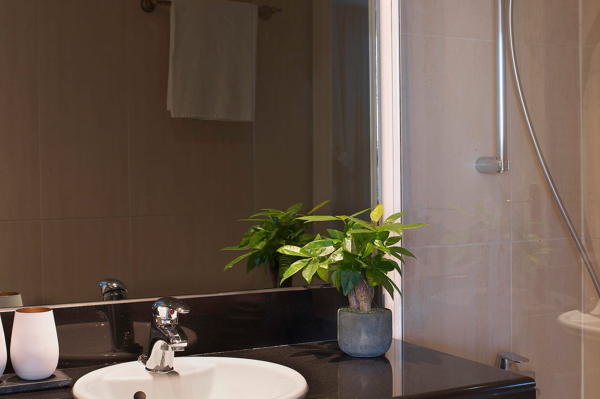 a sink and shower in a bathroom