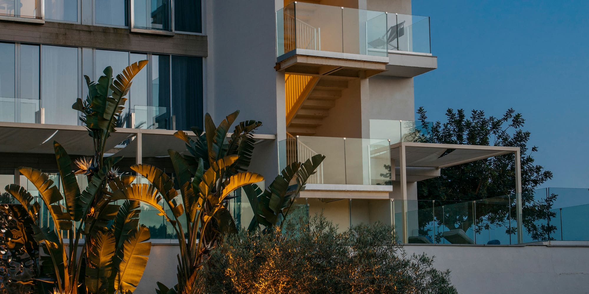 a building with trees and plants