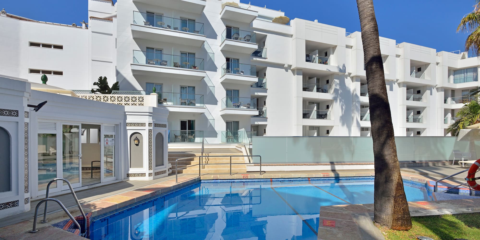 a swimming pool in front of a building