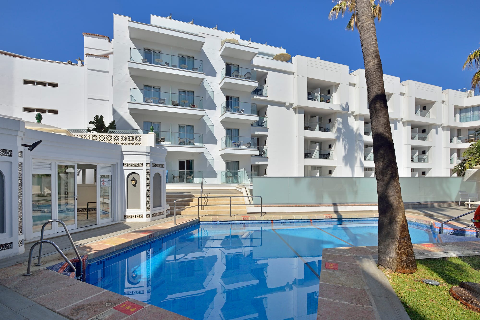 a swimming pool in front of a building