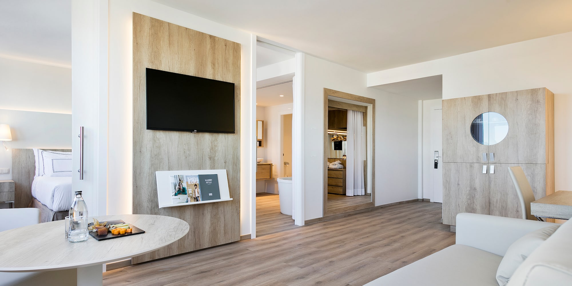 a room with a television and a wood floor