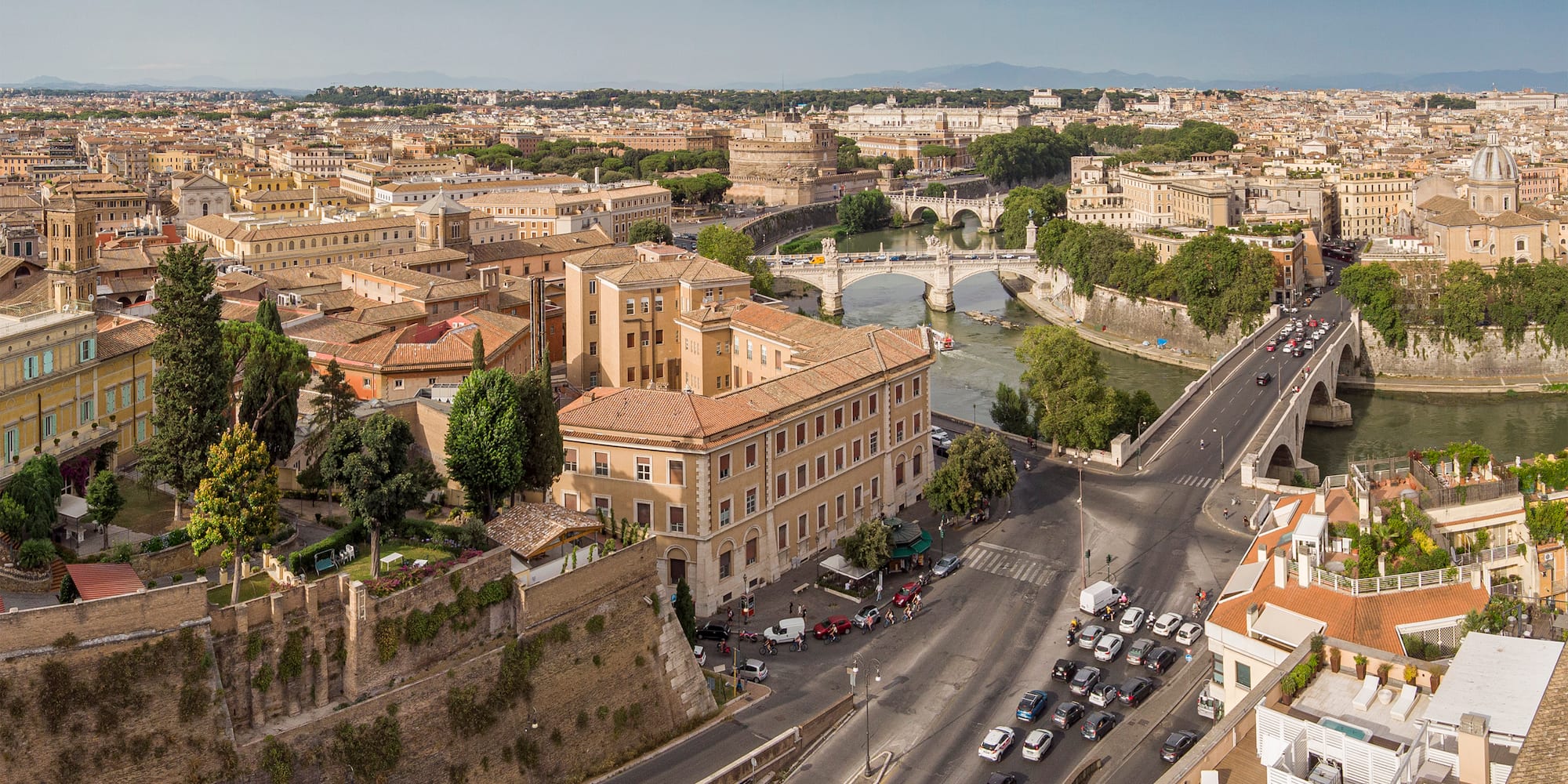 a city with a bridge and cars