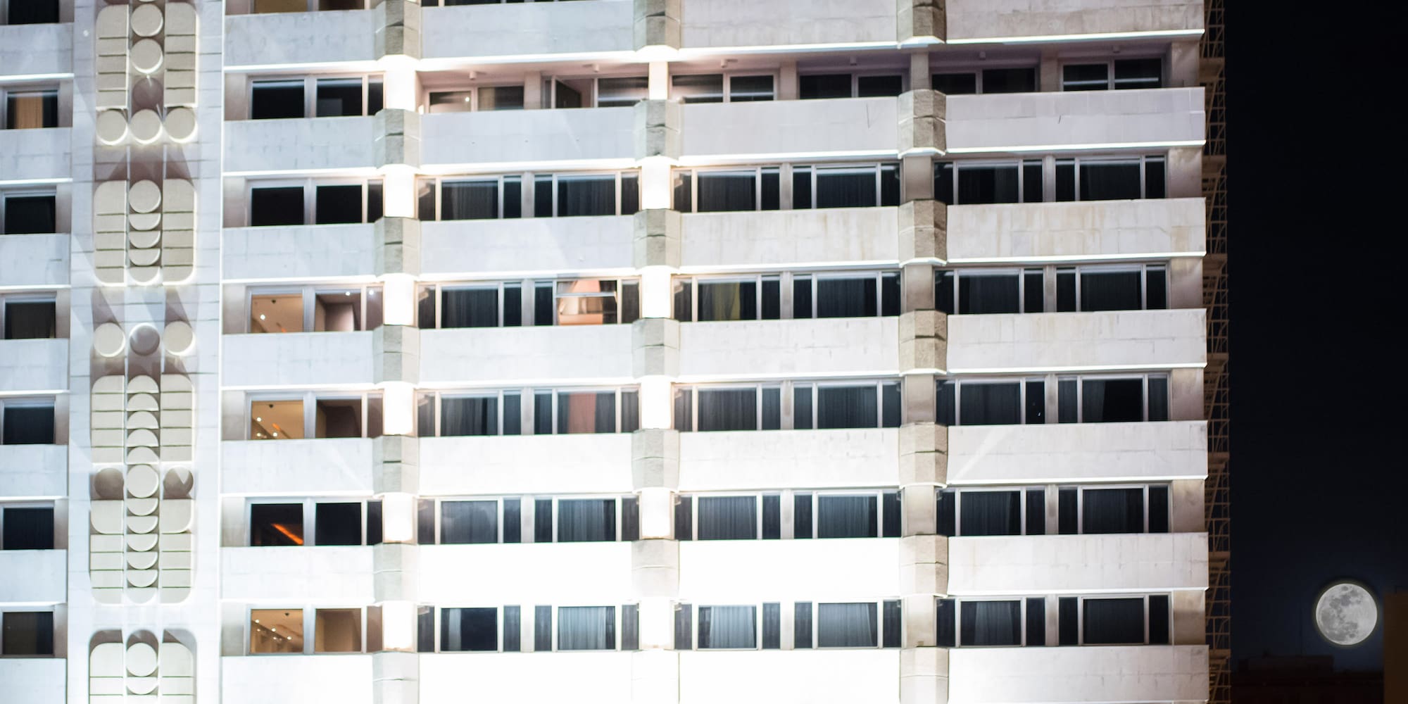 a building with a pool in front of it