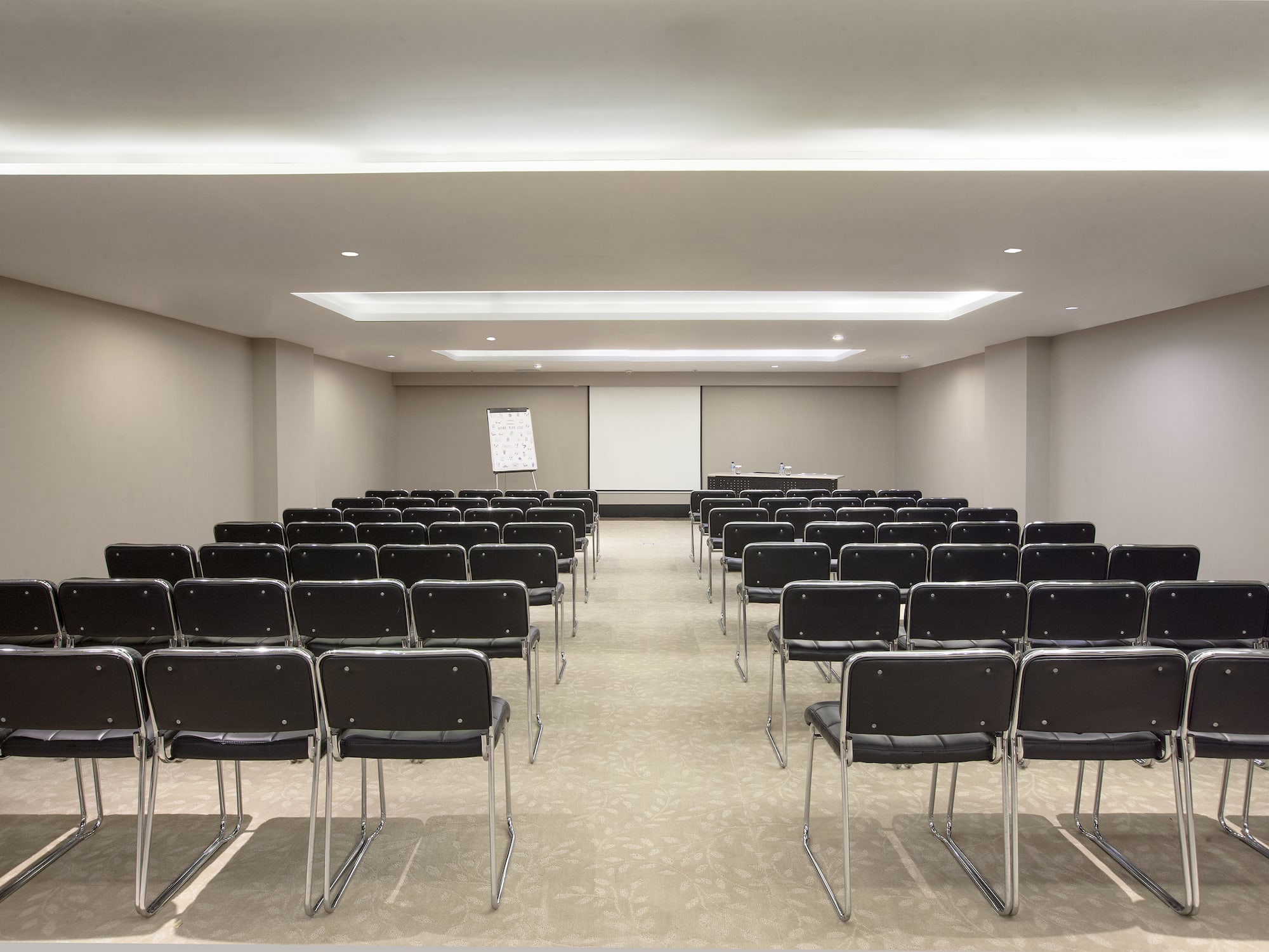 a room with rows of chairs
