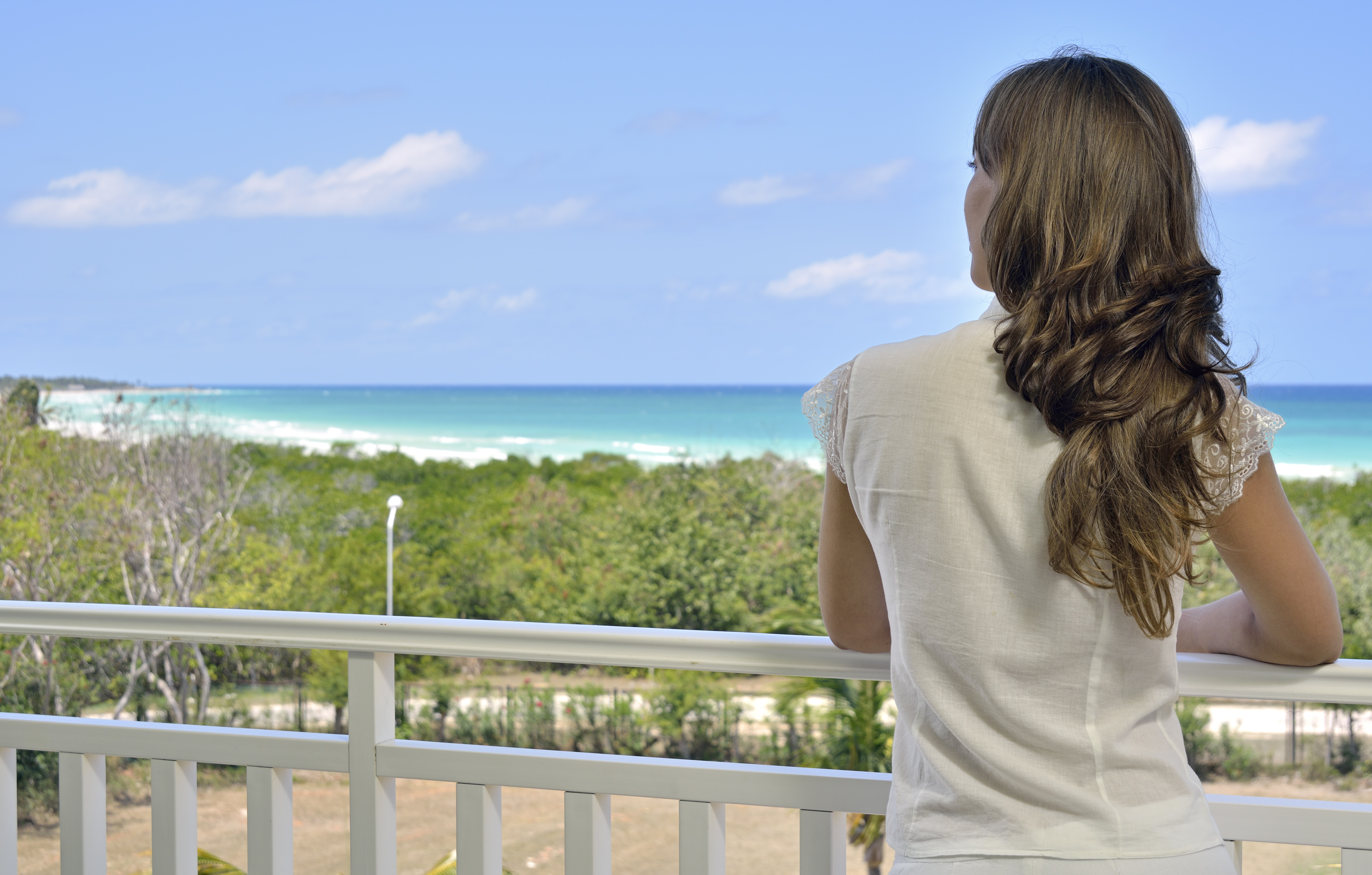 a woman looking at the ocean