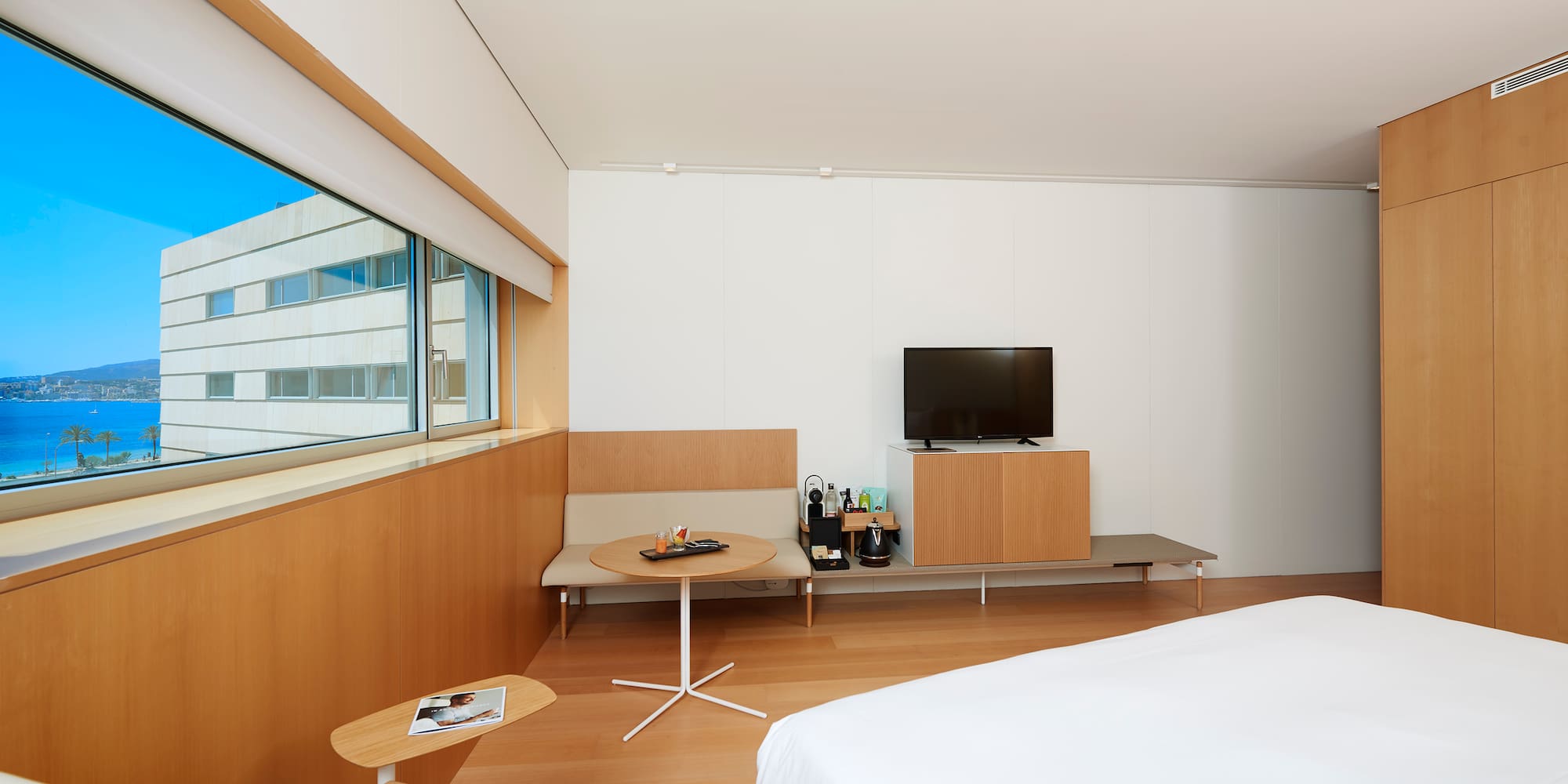 a room with a bed and a tv