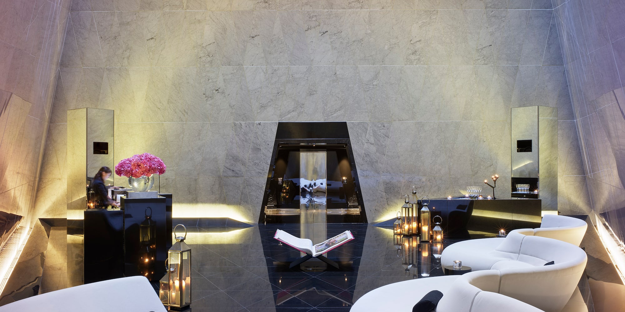 a room with a white couch and black floor