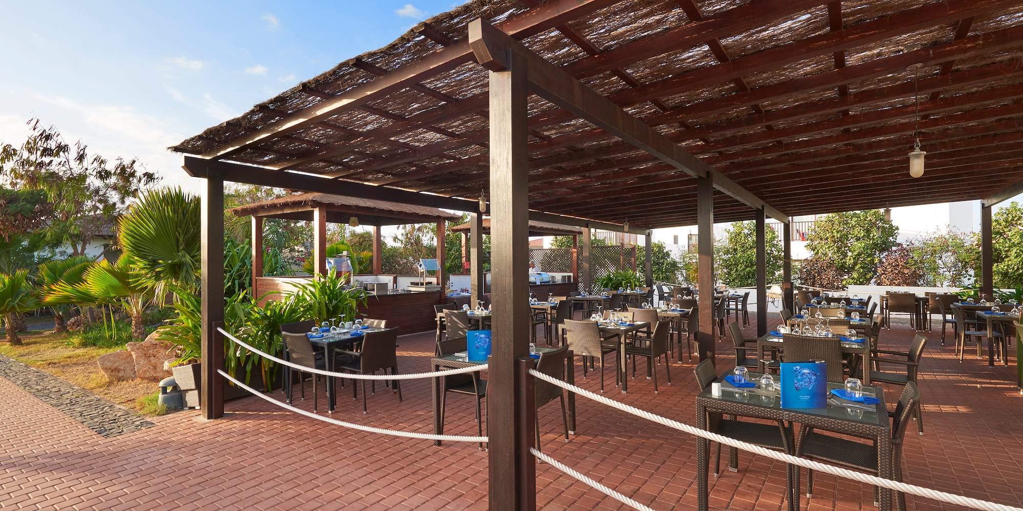 a patio with tables and chairs