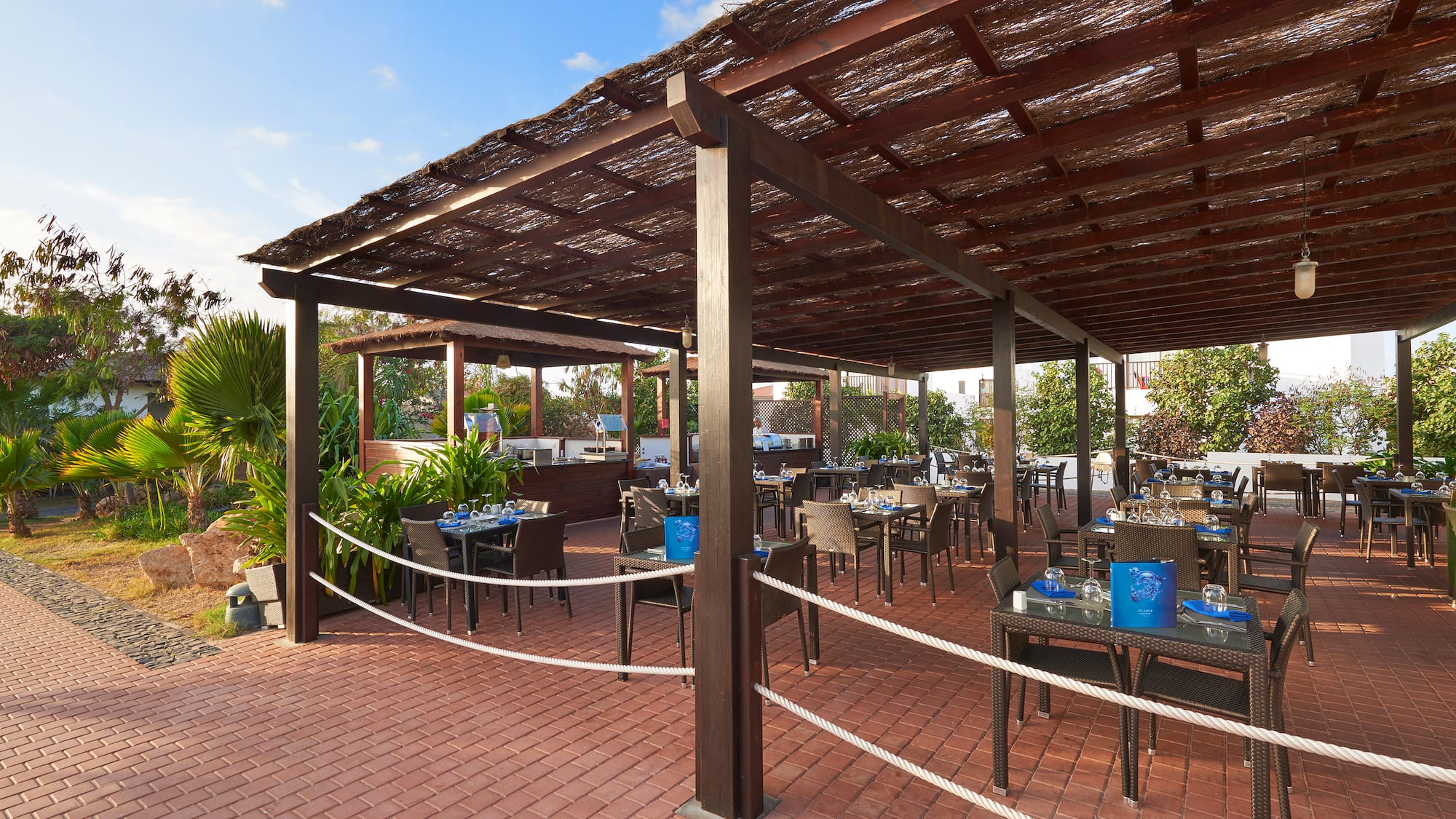 a patio with tables and chairs