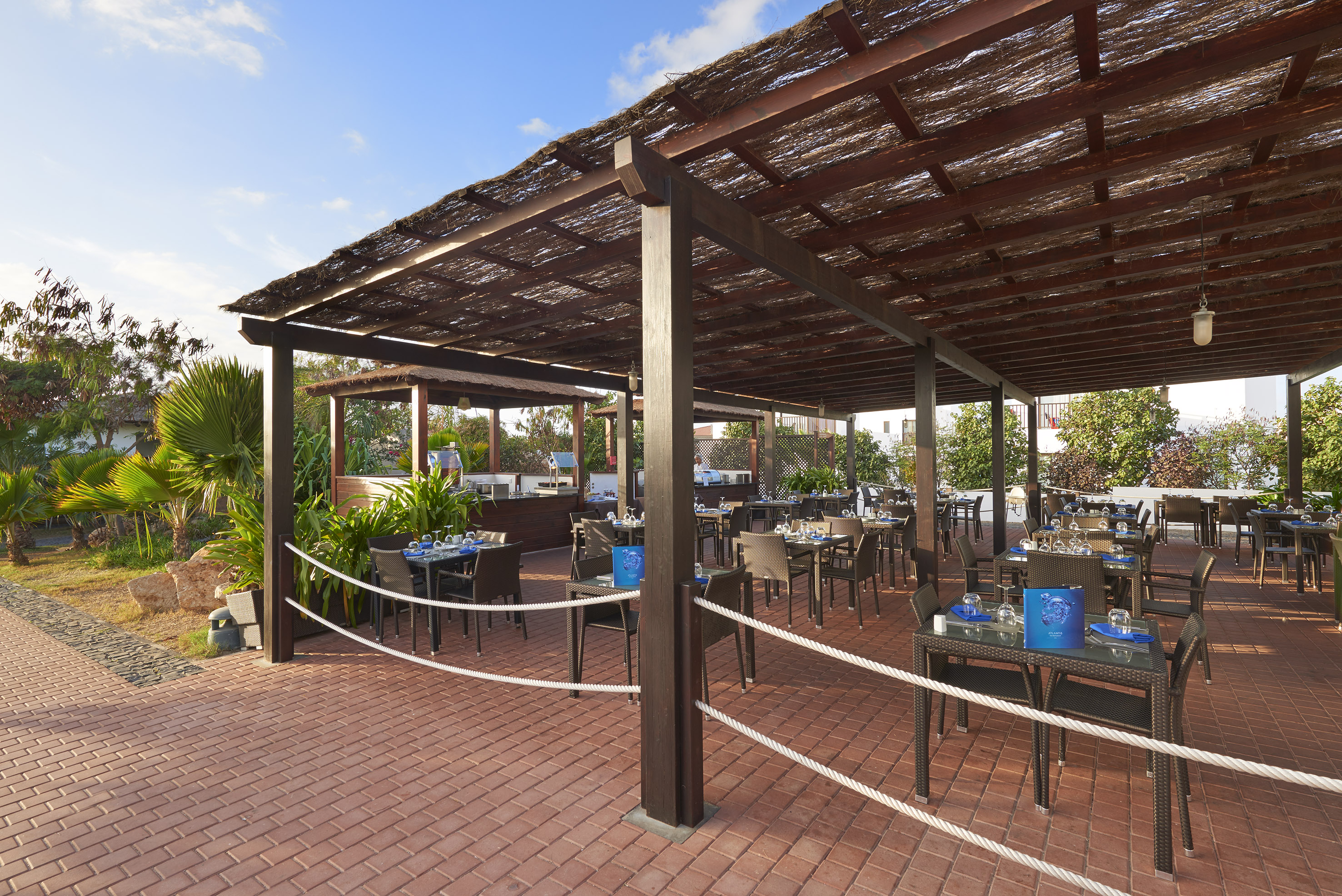 a patio with tables and chairs