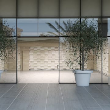 a glass door with trees in it