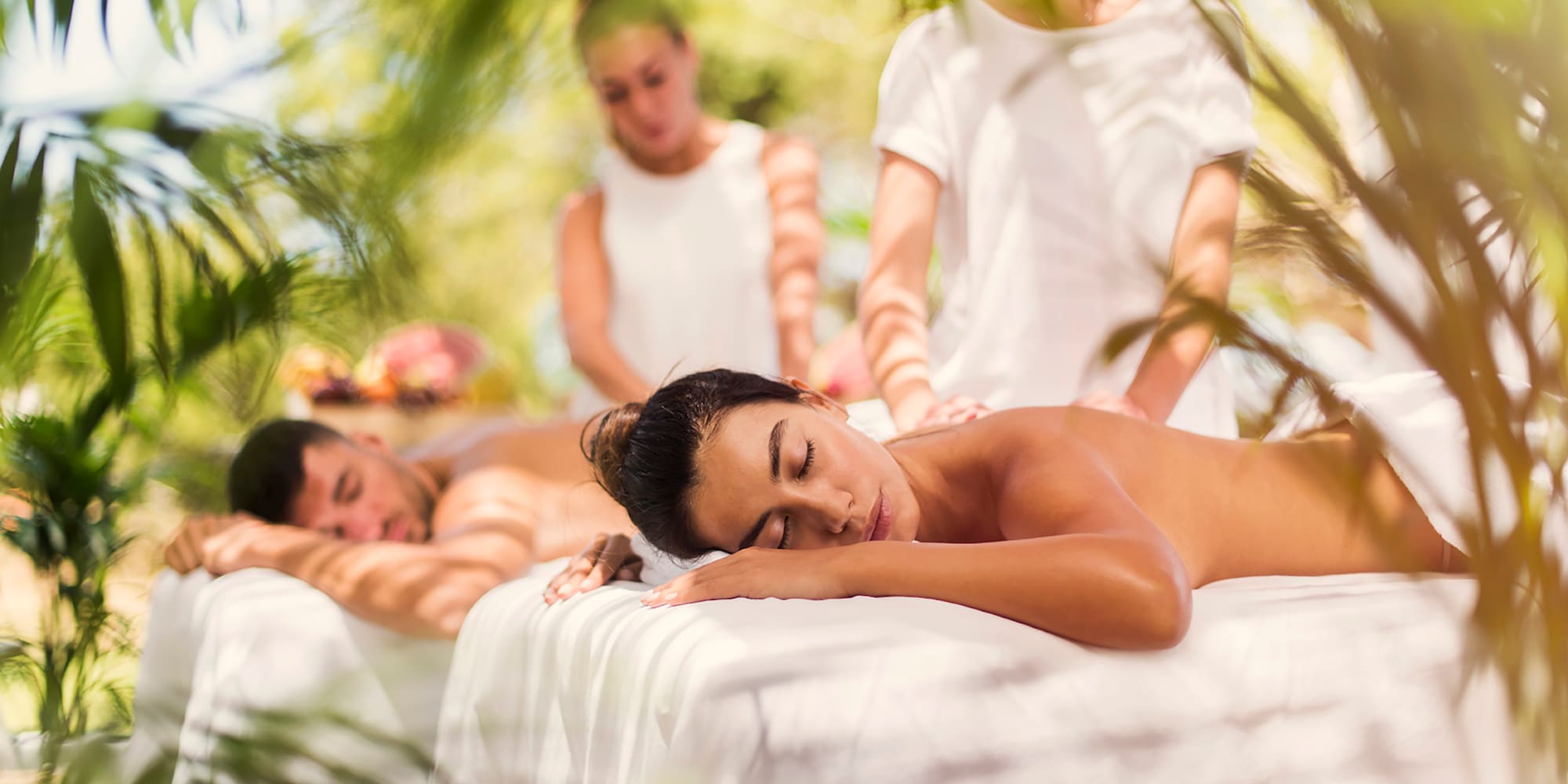 a group of people lying on a massage table