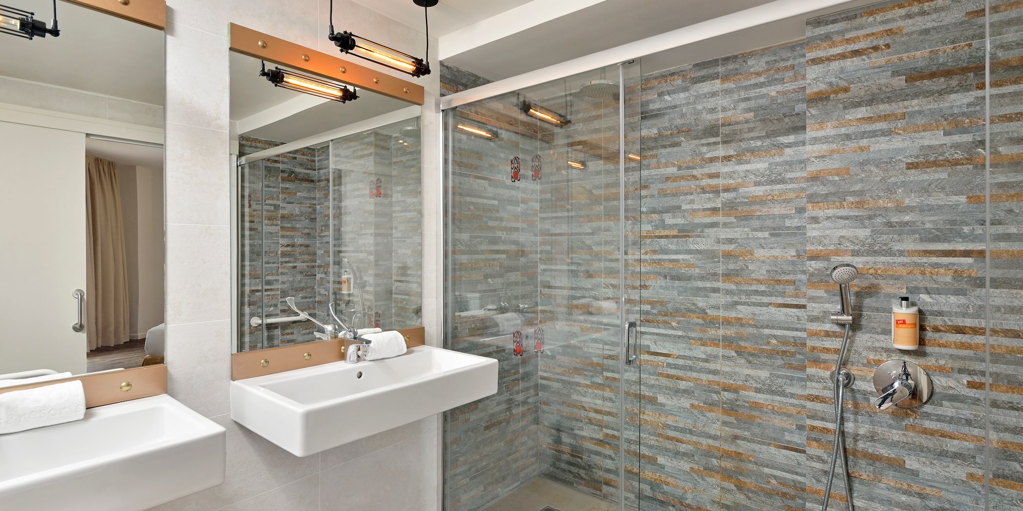 a bathroom with a shower and sink