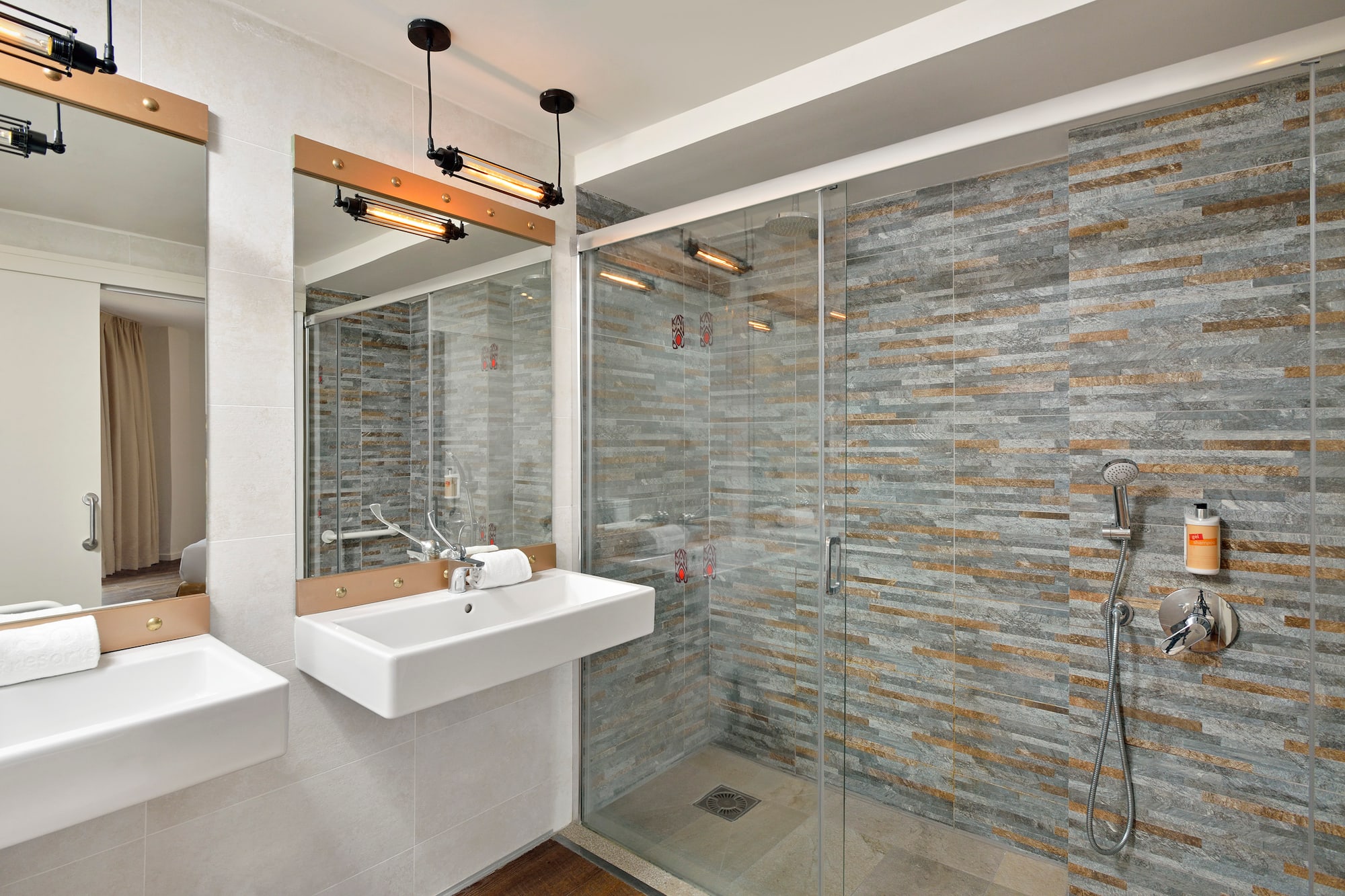 a bathroom with a shower and sink