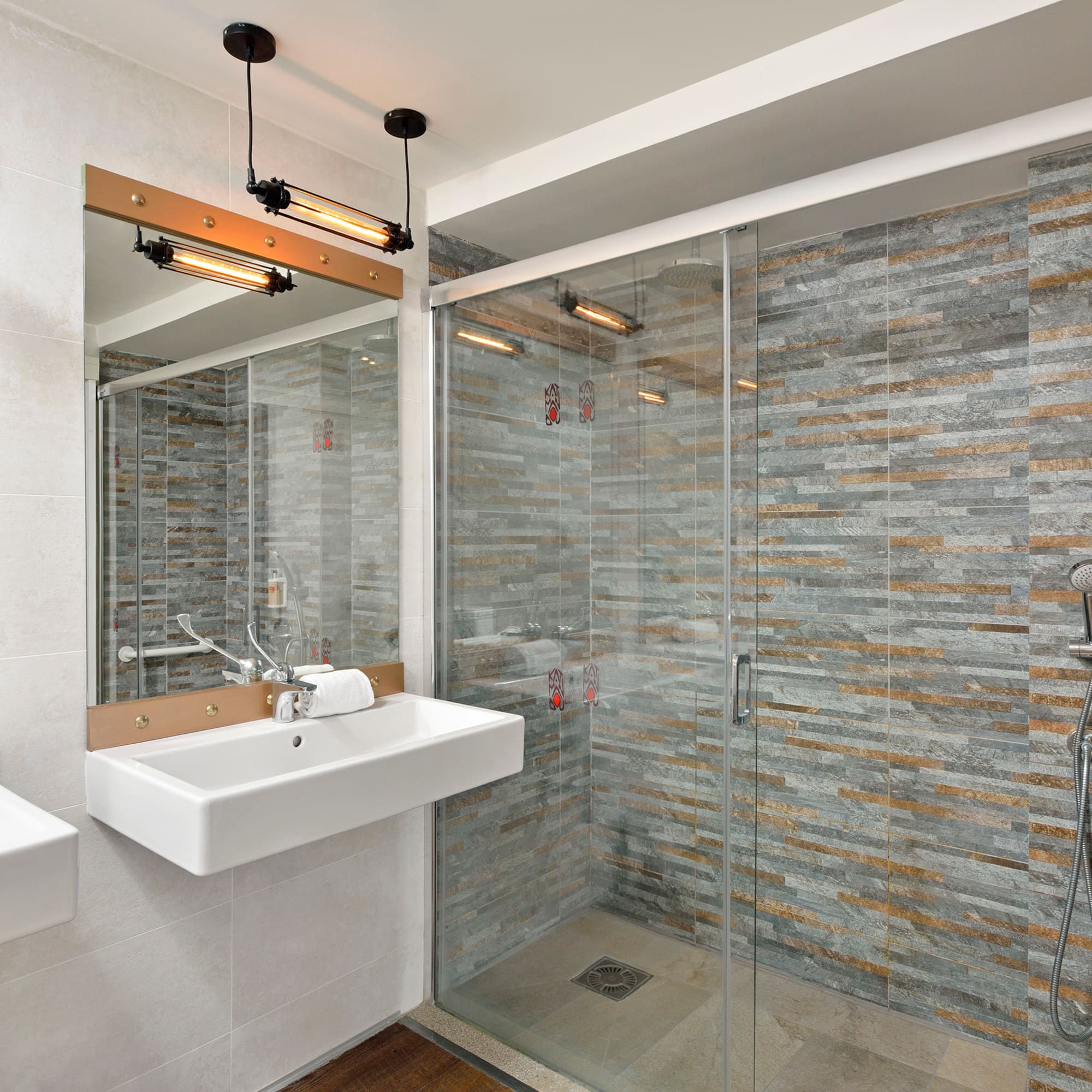 a bathroom with a shower and sink