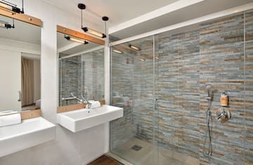 a bathroom with a shower and sink