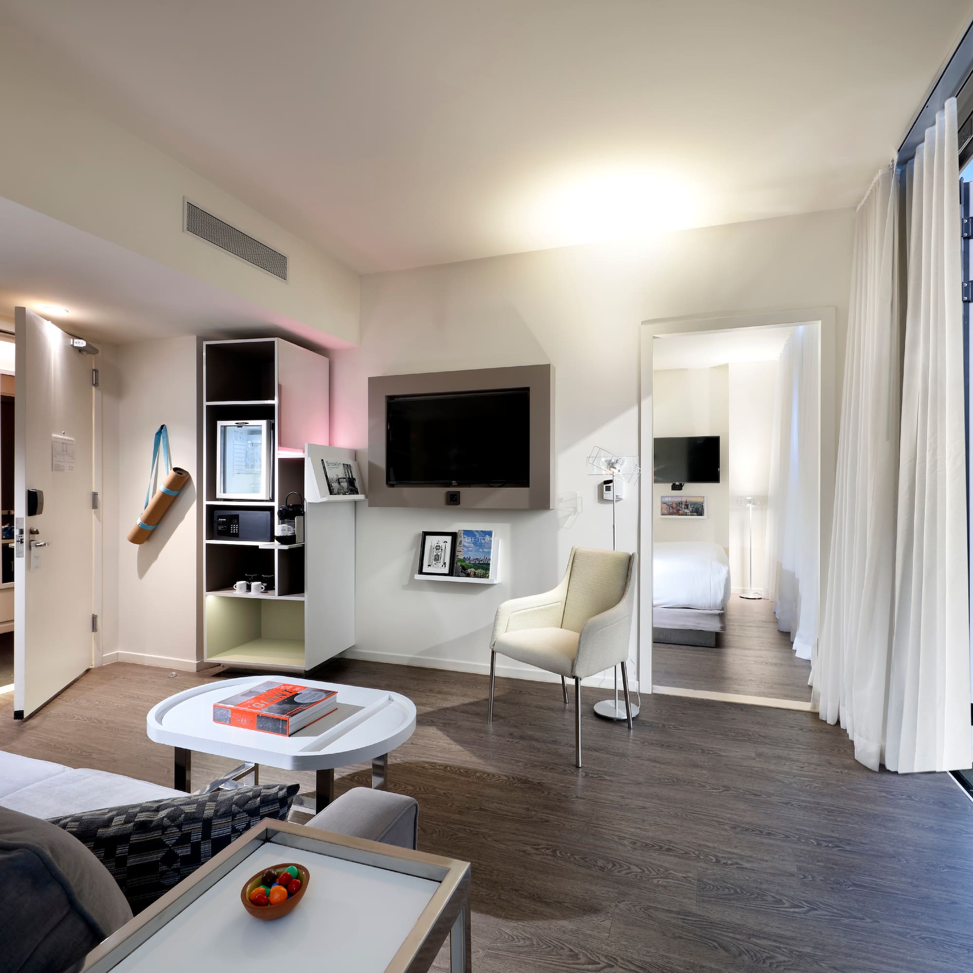 a room with a tv and a couch