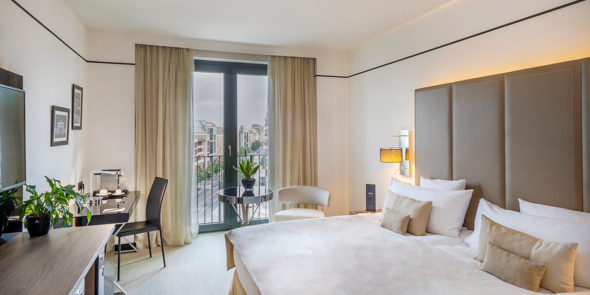 a bedroom with a bed and a desk and chair