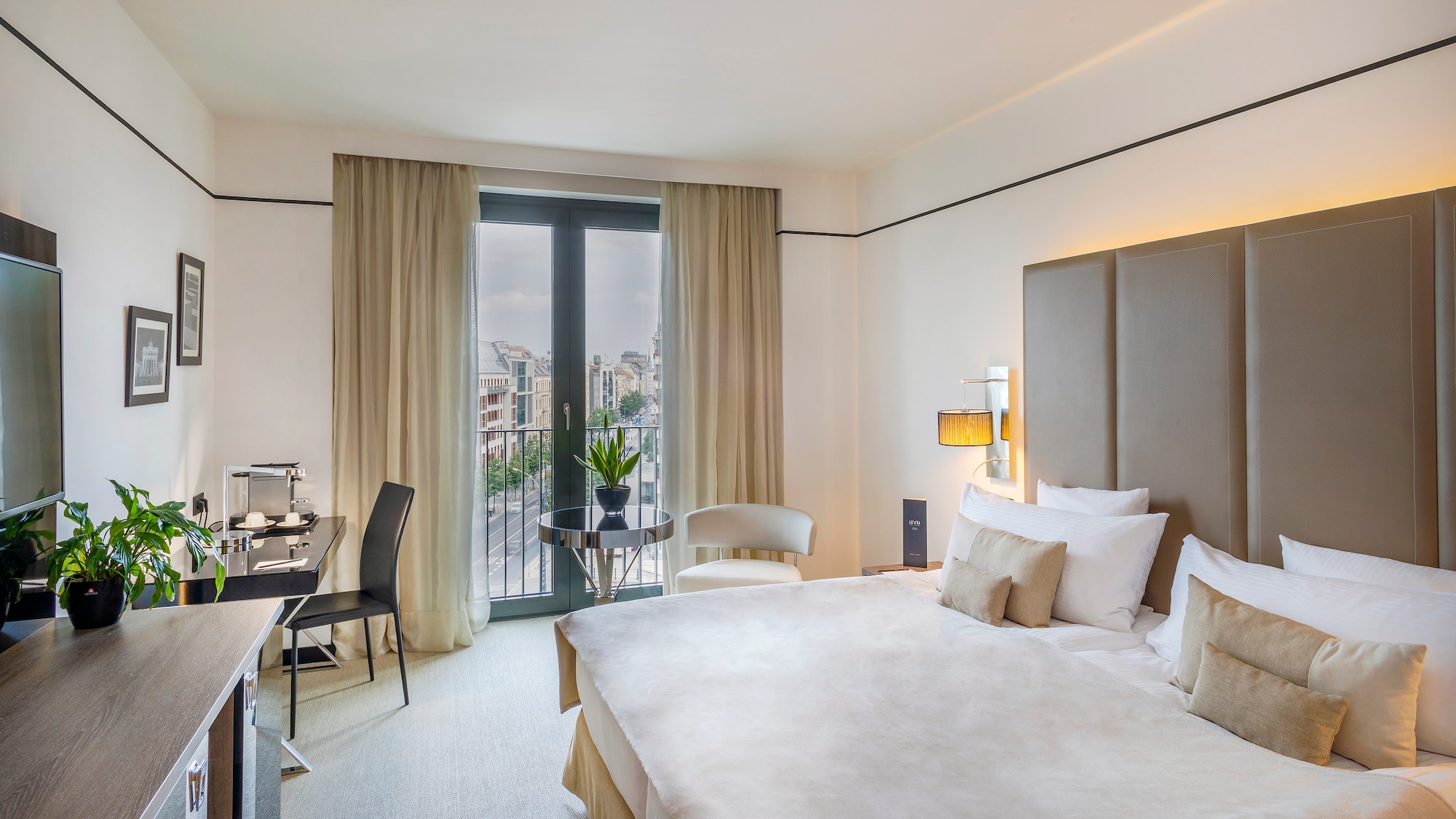 a bedroom with a bed and a desk and chair